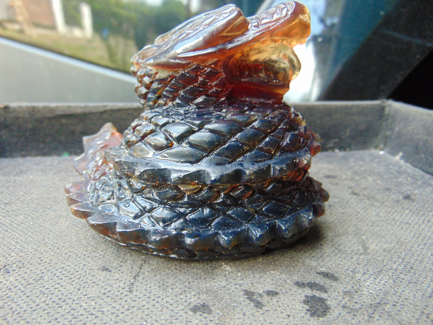 219 gram Dragon carving 100x83x70 mm Indonesian Blue Amber