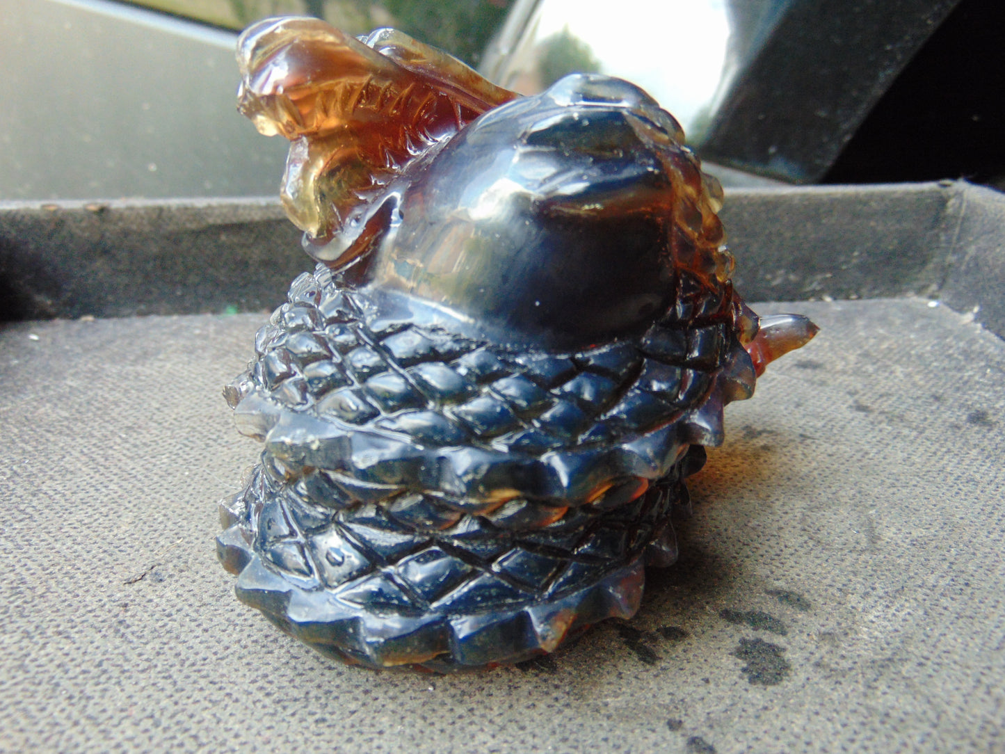 219 gram Dragon carving 100x83x70 mm Indonesian Blue Amber