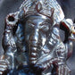 974 gr 9x6x2.8 in The carving of *Lord Ganesha* (God of Knowledge and Remover of Obstacles) on *Indonesian Dark Green Amber*