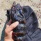 974 gr 9x6x2.8 in The carving of *Lord Ganesha* (God of Knowledge and Remover of Obstacles) on *Indonesian Dark Green Amber*