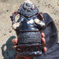 974 gr 9x6x2.8 in The carving of *Lord Ganesha* (God of Knowledge and Remover of Obstacles) on *Indonesian Dark Green Amber*