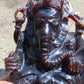 974 gr 9x6x2.8 in The carving of *Lord Ganesha* (God of Knowledge and Remover of Obstacles) on *Indonesian Dark Green Amber*